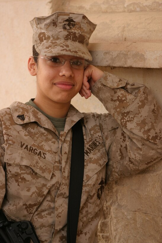 CAMP BLUE DIAMOND, AR RAMADI, Iraq -- Corporal Yaritza Vargas, a 21-year-old food services specialist with the 2nd Marine Division has been serving ground troops for the past three years with her specialty baking.  Now, during Operation Iraqi Freedom, the Brooklyn, N.Y. native is learning the ropes again.  Only this time, it's away from the kitchen stove.  U.S. Marine Corps photo by Sgt. Stephen D'Alessio (RELEASED)