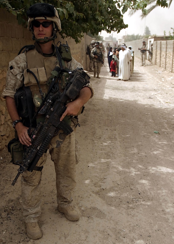 Karabilah, Al Anbar, Iraq (June 20, 2005)-- Lance Cpl. Shad K. Biffle, a 24-year-old Columbus, Ohio native and fireteam leader with 2nd platoon,  Company "L", 3rd Battalion, 25th Marine Regiment and members of the 7th Iraqi Security Force prepare to families out of immediate danger areas in Karabilah during Operation Spear. (Official USMC Photo by Corporal Ken Melton)