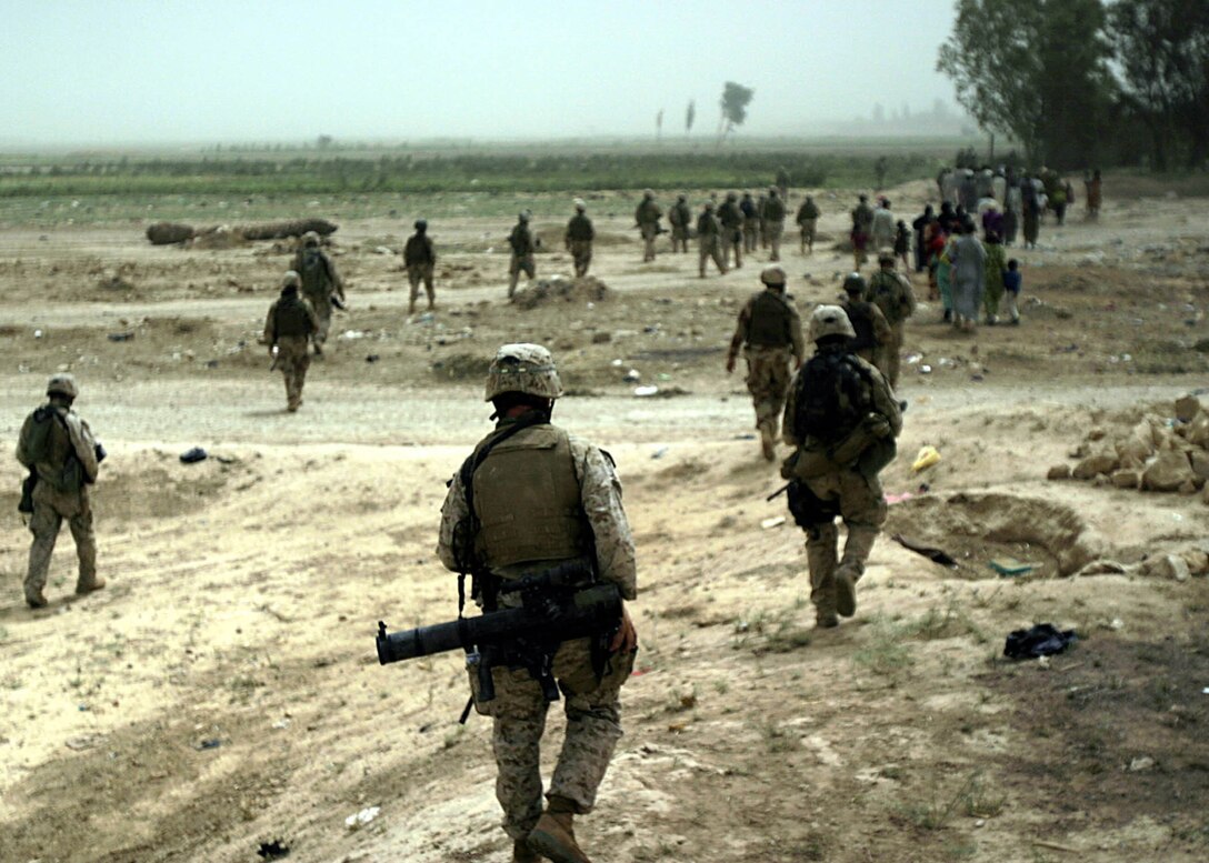 Karabilah, Al Anbar, Iraq (June 20, 2005)-- Marines with 2nd platoon, Company "L", 3rd Battalion, 25th Marine Regiment and members of the 7th Iraqi Security Force escort families out of immediate danger areas in Karabilah during Operation Spear. (Official USMC Photo by Corporal Ken Melton)