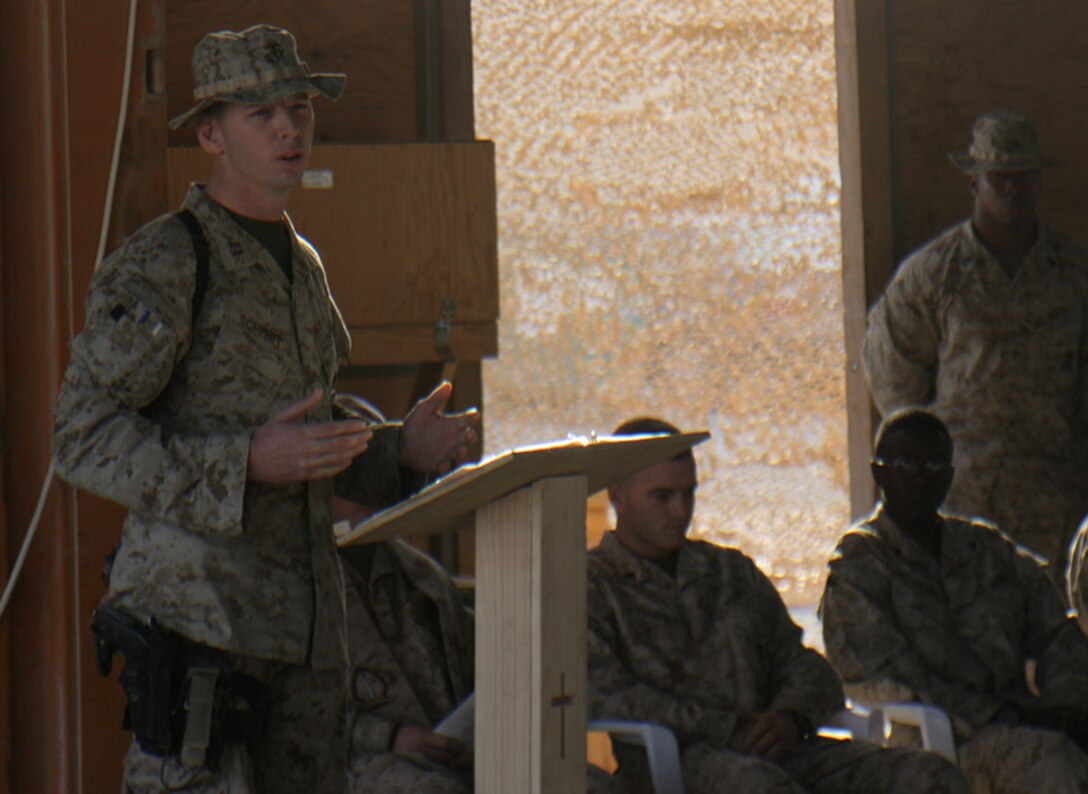 051020-M-2607O-006 - Captain Joel F. Schmidt, Company G commander, talks about his fallen Marines during the memorial service Oct. 20 aboard Camp Fallujah because they paid the ultimate price for freedom.