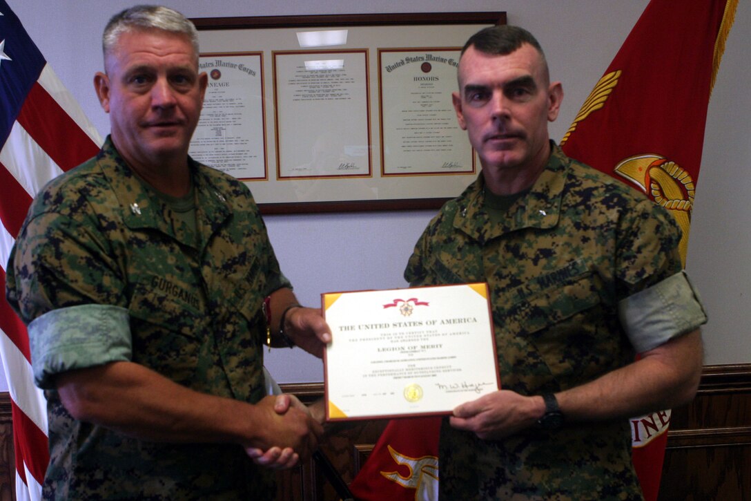 MARINE CORPS BASE CAMP LEJEUNE, N.C. (Oct. 20, 2005)- Col. Charles M. Gurganus (left) was awarded the Legion of Merit Medal by BGen. Joseph J. McMenamin, assistant commanding officer of 2nd Marine Division at a ceremony here today. Gurganus was the commanding officer of Regimental Combat Team-8 in Iraq from March 7 to August 9, 2005 in support of operation Iraqi Freedom. (Official U.S. Marine Corps photo by Lance Cpl. Lucian Friel (RELEASED)