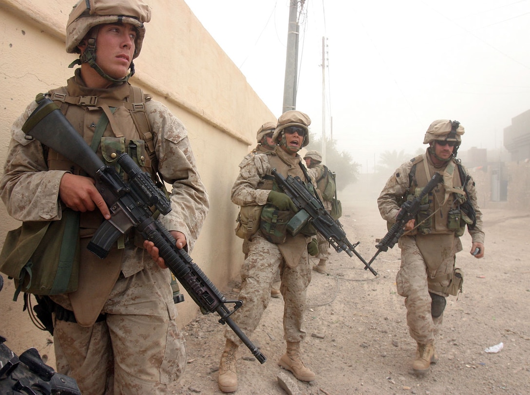 CAMP AL QA'IM, Iraq (Nov. 15, 2005) -- Albany, N.Y., native Lance Cpl. Paul J. Kolkhorst, an antitank assaultmen (left), stands ready to advance with the Marine of Company I, 3rd Battalion, 6th Marine Regiment, Regimental Combat Team - 2.  (Official U.S. Marine Corps phot by Sgt. Jerad W. Alexander)