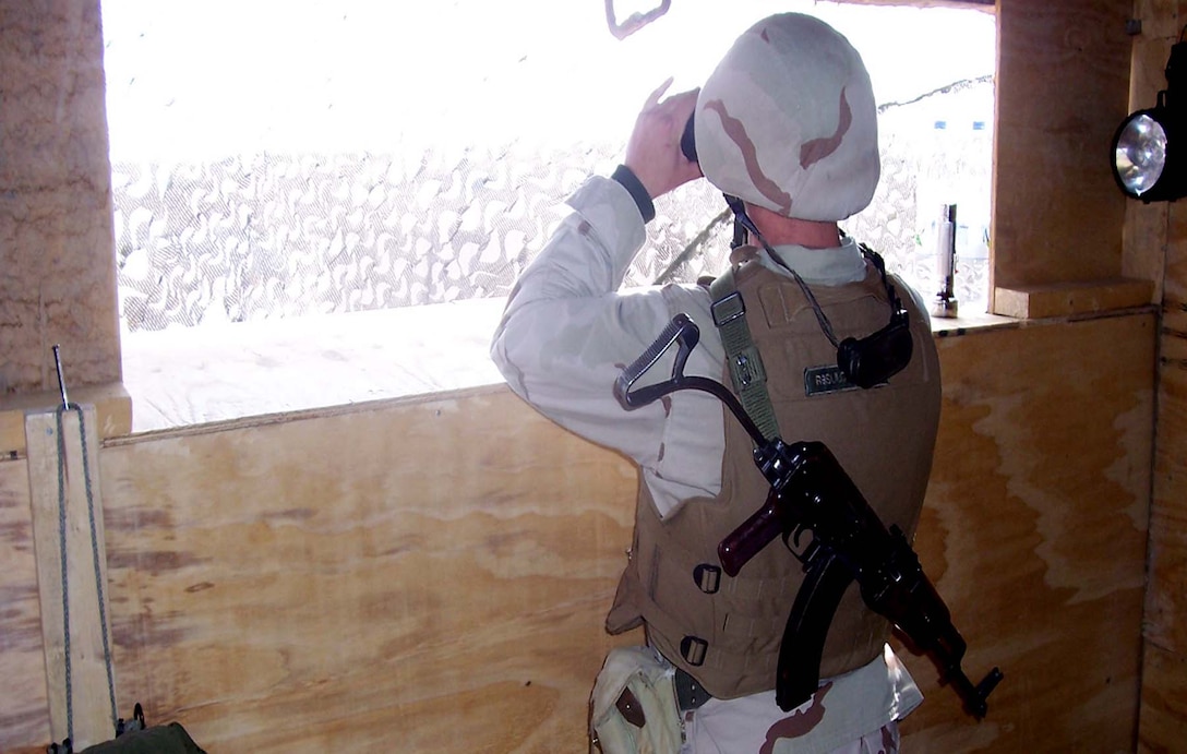 HADITHA DAM, Iraq (Dec. 8, 2005)  - An Azerbaijani Army soldier looks out one of the dam's observation posts here. The soldiers man this and many other posts around the base making sure the area stay safe. (Photo courtesy of Azerbaijani Army Capt. Rashad Garayev)