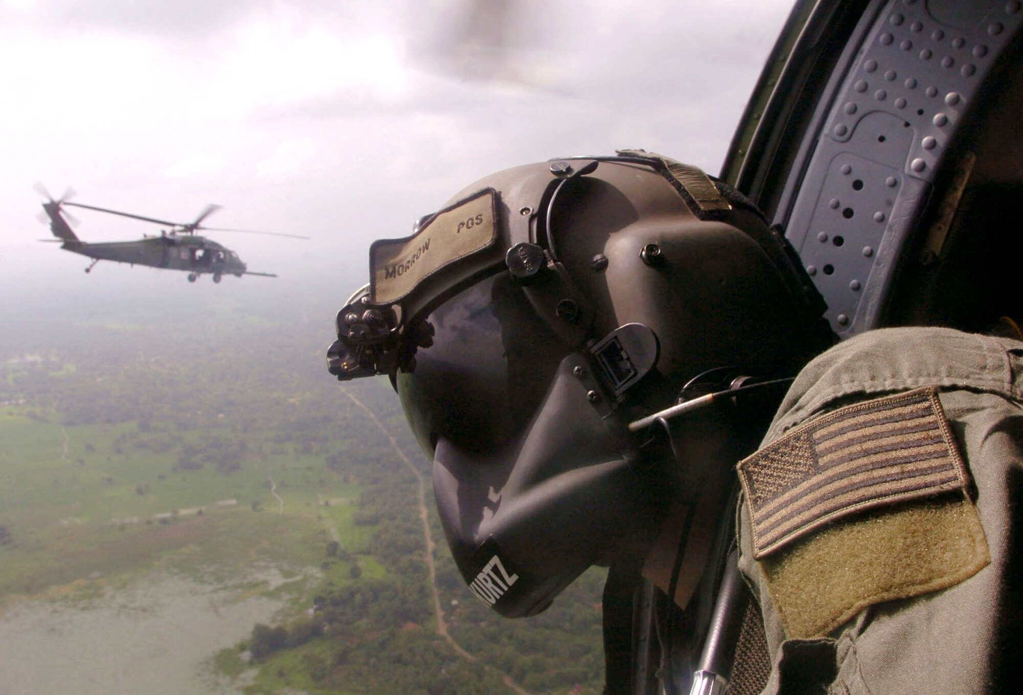 OVER SRI LANKA -- Senior Airman Matt Morrow scans the Sri Lankan horizon during tsunami relief operations here.  His HH-60G Pave Hawk helicopter delivered supplies and equipment to various relief distribution centers.  Airman Morrow is an aerial gunner from the 33rd Rescue Squadron at Kadena Air Base, Japan, supporting Operation Unified Assistance.  (U.S. Air Force photo by Master Sgt. Val Gempis)