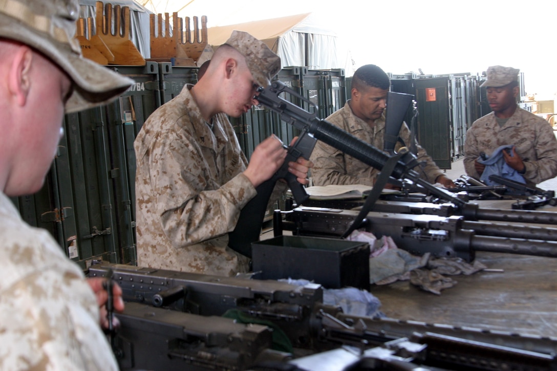 Al Asad, Iraq- Lance Cpl. James Paul, helicopter mechanic, Marine Medium Helicopter Squadron 774 and Suffulk, Va., native cleans his M16A2 service rifle before returning home after a seven-month deployment in Iraq. Paul along with his HMM-774 counter parts are going home for a six months before returning in September to replace HMM-264.