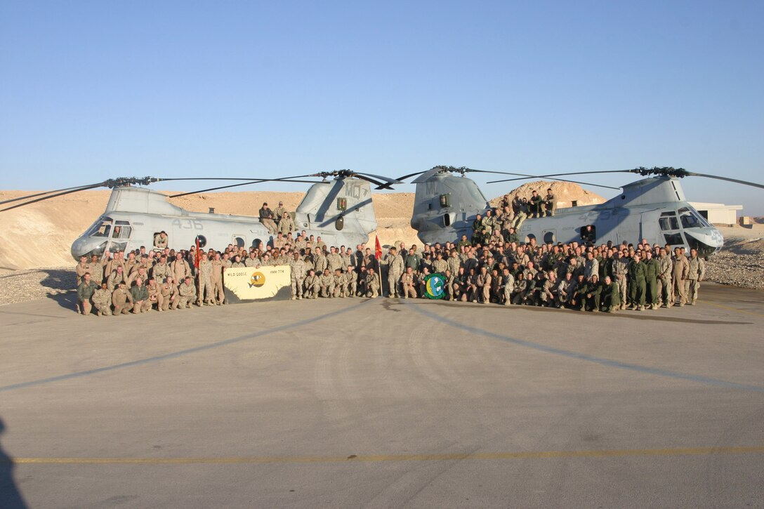 Al Asad, Iraq- Marine Medium Helicopter Squadron 774 and HMM-764 pose for a photo during the second time they have replaced one another in Iraq. The two squadrons will swap places one more time when the Wild Geese of HMM-774 replace the Moonlighters of HMM-764 later this year.