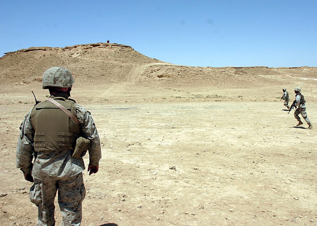 Camp Ripper,Al Asad, Iraq (May 21, 2005) - Sgt. Andrew J. Wittmer, 25, of Peoria, Illi., and an instructor during this training phase watches a soldier of the reconnaissance company of the 7th Iraqi Security Battalion perform a drill.  (Official USMC photo by Cpl. Ken Melton)