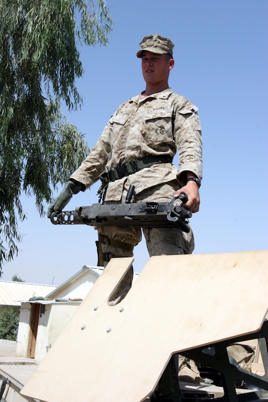 AR RAMADI, Iraq (September 20, 2005) - Lance Cpl. Joel Mulligan, machine gunner with Black Platoon, Combined Anti-Armor Team, Weapons Company, 3rd Battalion, 7th Marine Regiment, prepares his humvee for a patrol later in the day. This is Mulligan's second tour in Iraq. Photo by Cpl. Shane Suzuki