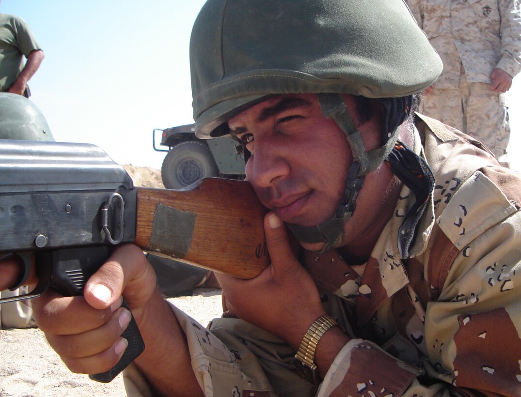 CAMP HABBANIYAH, Iraq - An Iraqi Soldier aims in an RPK light machine gun during the Iraqi Small Arms Weapons Instructor Course taught by the Marines of the 2nd Marine Division Training Center here.
