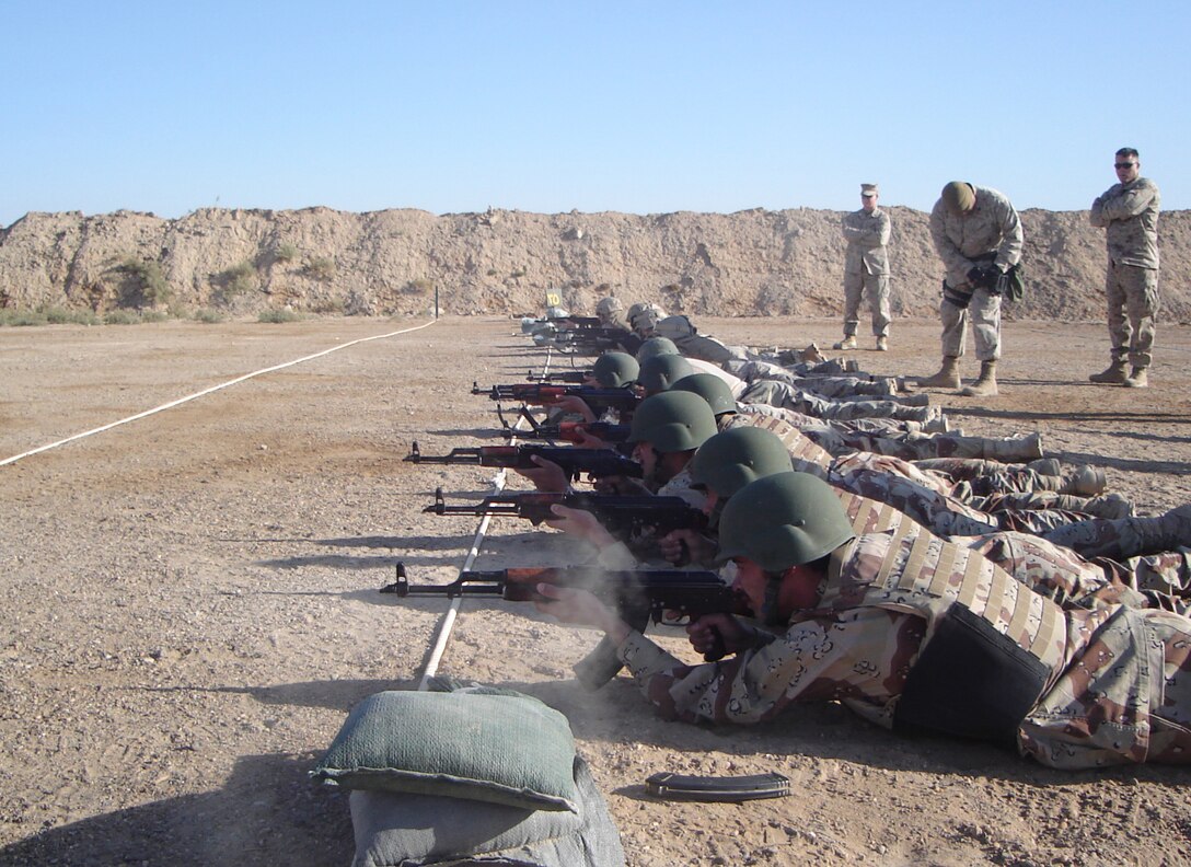 CAMP HABBANIYAH, Iraq - Iraqi Soldiers aim in their AK-47s during the zeroing portion of the Iraqi Small Arms Weapons Instructor Course taught by the Marines of the 2nd Marine Division Training Center here.