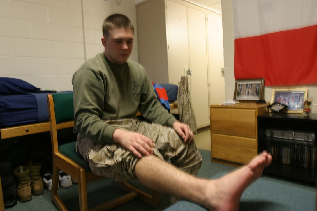 MARINE CORPS BASE CAMP LEJEUNE, N.C. (January 18, 2005) - Lance Cpl. Jeffrey R. Surdi began his Marine Corps career as a rifleman with 3rd Battalion, 6th Marine Regiment but found himself undeployable due to foot problems.  The Mastic, N.Y., native now works at the casualty cell where his job is to keep track of injured Marines and keep units and families updated on the status of their Marine.  Surdi's experience while recovering gave him a newfound interest in physical therapy.  He plans on going to college and majoring in the field after his enlistment. "I have become familiar with physical therapy due to my injury," Surdi said.  "My physical therapist really inspired me.  I think it will be fulfilling and fun at the same time." Official Marine Corps photo by Pfc. Terrell A. Turner released.