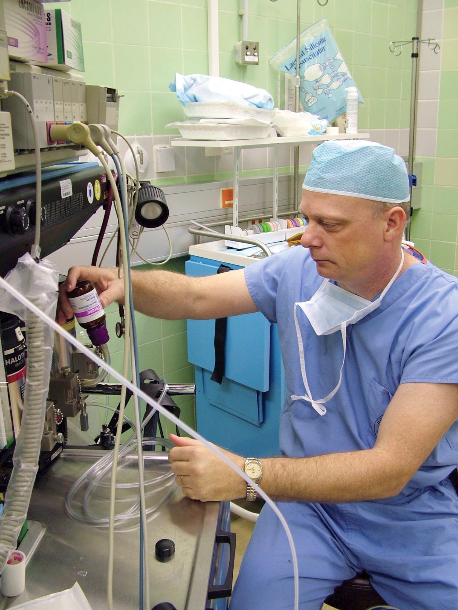 SPANGDAHLEM AIR BASE, Germany -- Lt. Col. Mike Bagwell refills a machine with anesthesia gas that is used to keep the patient asleep for surgery.  He is the 52nd Medical Support Squadron surgical services flight commander.  (U.S. Air Force photo by Airman 1st Class Eydie Sakura)  
