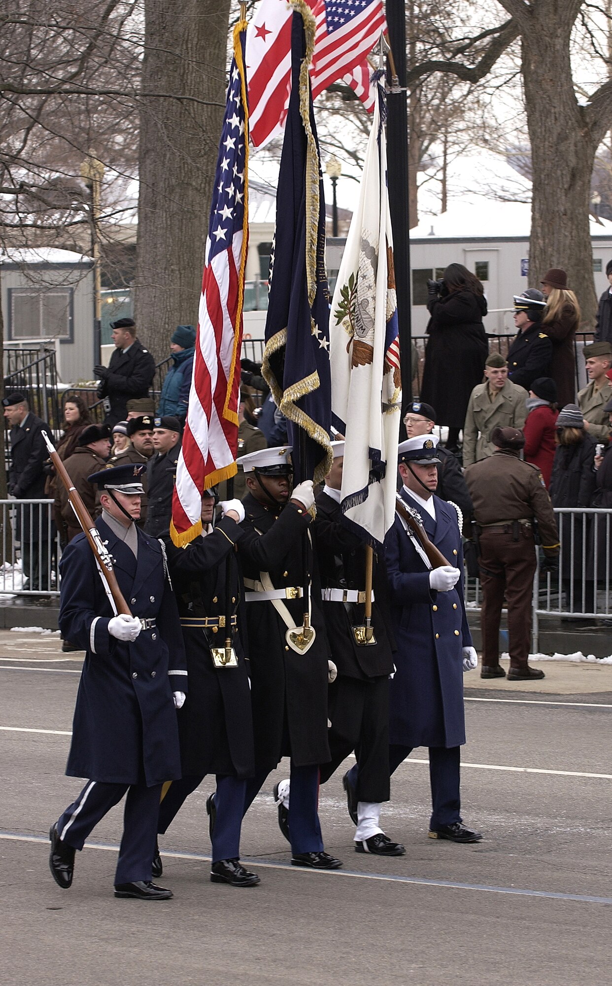 WASHINGTON -- The Joint Service Color Guard marches during the Presidential Inaugural Parade here Jan. 20.  Joint Task Force-Armed Forces Inaugural Committee officials are responsible for coordinating all military ceremonial support for the inauguration.  Support included musical units, marching units, color guards, firing details and salute batteries.  (U.S. Air Force photo by Staff Sgt. Victoria Meyer)
                       