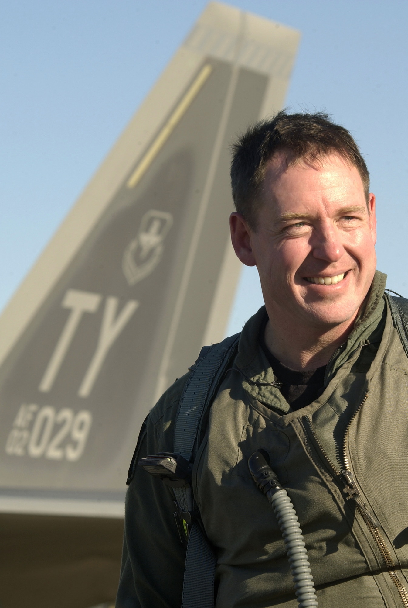 LANGLEY AIR FORCE BASE, Va. -- Lt. Col. James Hecker, selected to command the first active F/A-22 Squadron, stands in front of the Raptor that he flew from Tyndall Air Force Base, Fla., to here Jan. 18.  The aircraft will be the first combat ready F/A-22 Raptor used for mission sorties.  Lt. Col. Hecker is the 27th Fighter Squadron commander.  (U.S. Air Force photo By Staff Sgt. Samuel Rogers)