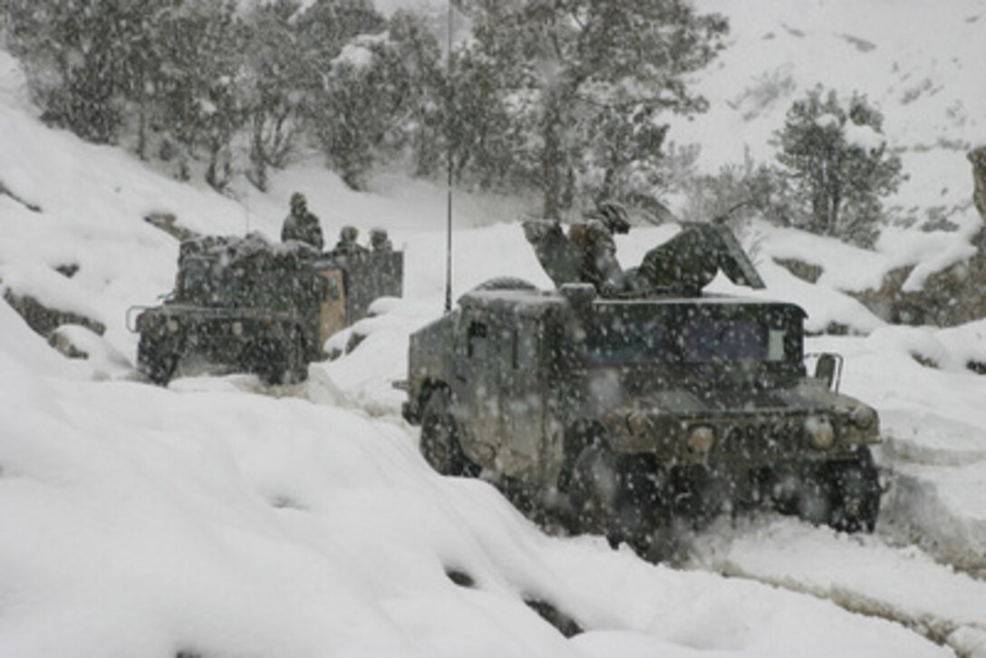U.S. Marines conduct a mounted patrol in the cold and snowy weather of the Khowst-Gardez Pass in Afghanistan on Dec. 30, 2004. Marines of the 3rd Battalion, 3rd Marines, are conducting security and stabilization operations in support of Operation Enduring Freedom. 