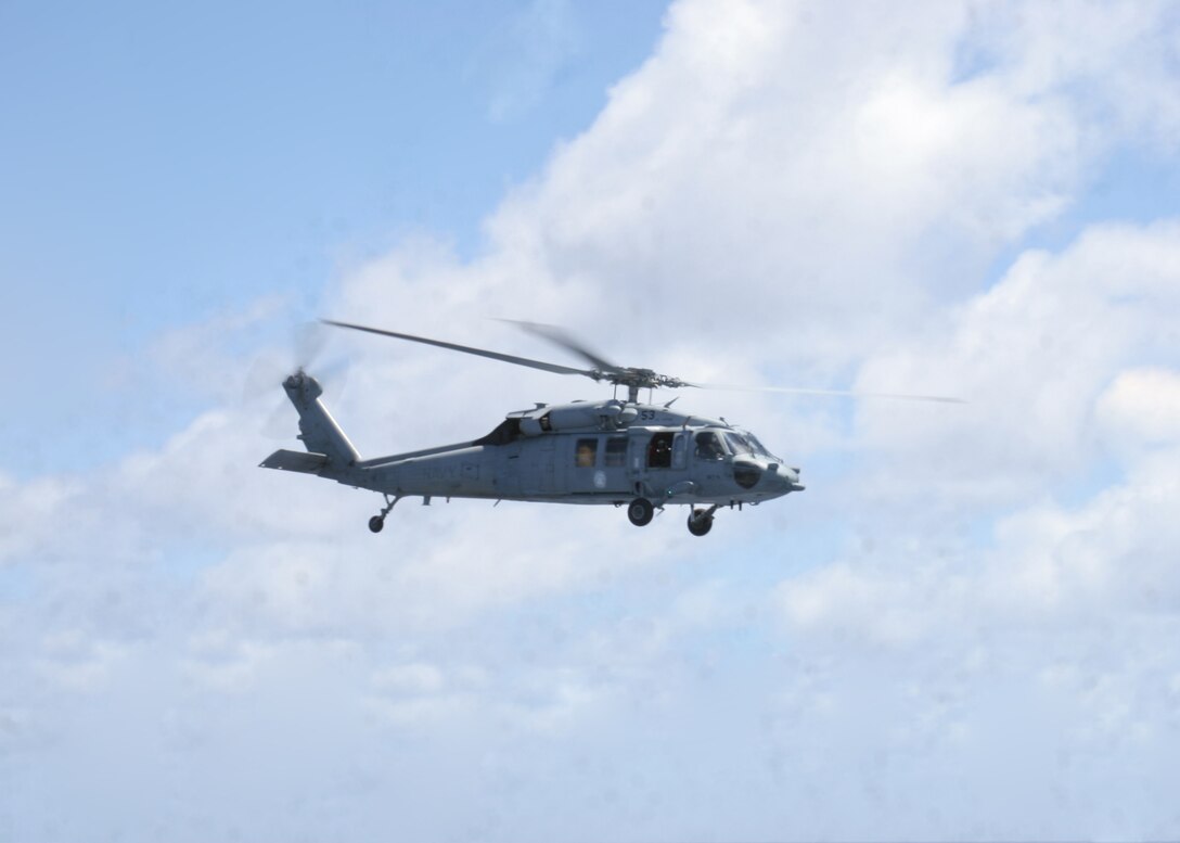 ABOARD USS PELELIU (LHA-5), (Sept. 29, 2008)- A MH-60S Seahawk helicopter maneuvers into position during a vertical replenishment, Sept. 29. Vertical replenishments are designed to resupply a Peleliu using helicopters to transport supplies from one ship to another.::r::::n::The Camp Pendleton, Calif., based 15th MEU is embarked aboard USS Peleliu and is comprised of approximately 2,200 Marines and Sailors and is a forward deployed force in readiness capable of conducting numerous operations, such as Non-Combatant Evacuation Operations, Humanitarian Assistance Operations and range of amphibious missions.  The MEU is currently deployed aboard USS Peleliu (LHA-5), USS Dubuque (LPD-8) and USS Pearl Harbor (LSD-52).   (Official USMC photo by Cpl Stephen Holt)::r::::n::