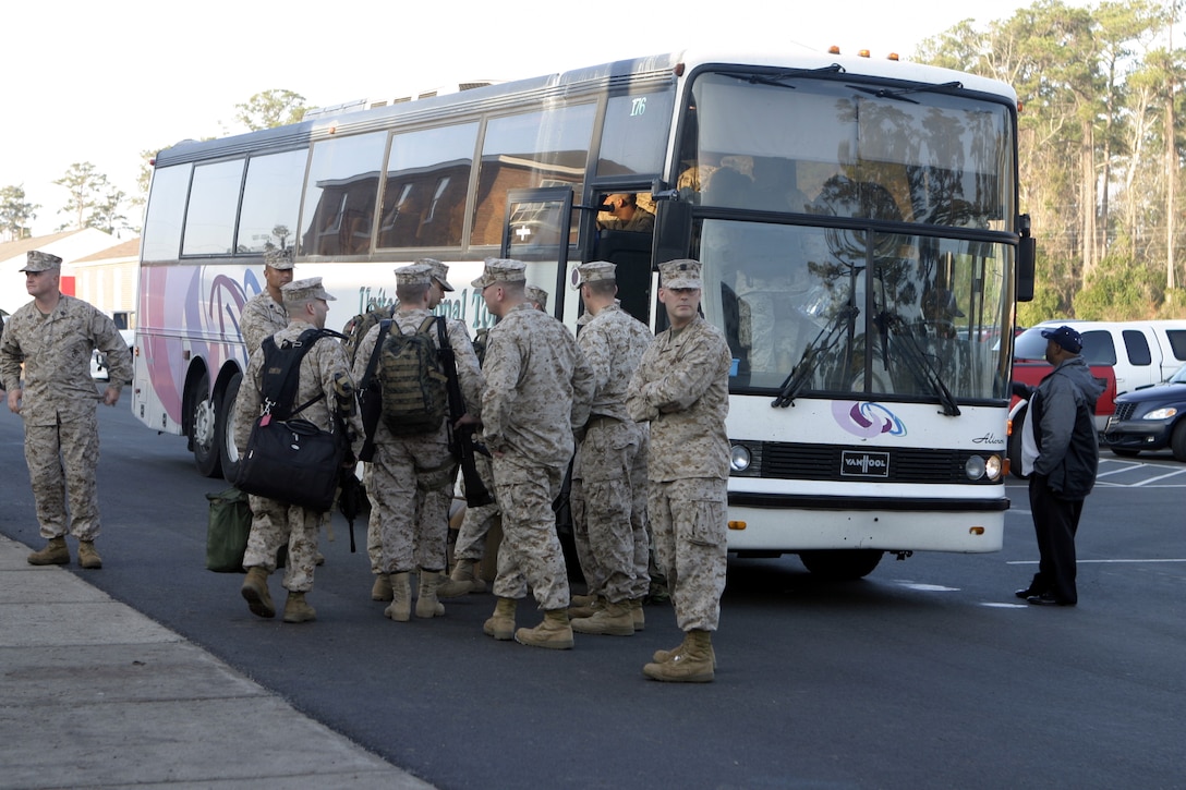 MARINE CORPS BASE CAMP LEJEUNE, N.C. - Marines with 1st Battalion, 6th Marine Regiment's advance party board buses bound for Cherry Point Air Station, N.C., where they would fly out to Iraq.  The advance party's approximately 50 Marines and sailors left here to help pave the way for the arrival of the main body in March.