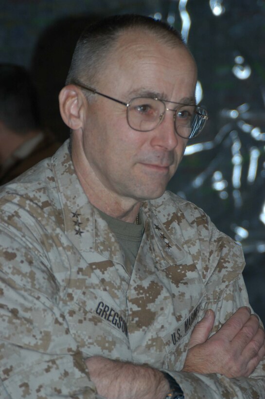 CAMP HURRICANE POINT, Ar Ramadi, Iraq(March 22, 2005) - Lieutenant. Gen. Wallace C. Gregson, commanding general of U.S. Marine Forces Pacific, met with Lt. Col. Eric M. Smith, commanding officer, 1st Battalion, 5th Marine Regiment, and other Marines of the Infantry battalion's command element in the in the Command Operations Center Conference Room here. General Gregson visited HP during his tour of the areas' Marine Camps. Nine Marines and one Navy corpsman had the opportunity to meet the general and listen to him discuss the importance of their efforts in Operation Iraqi Freedom. Photo by Cpl. Tom Sloan.