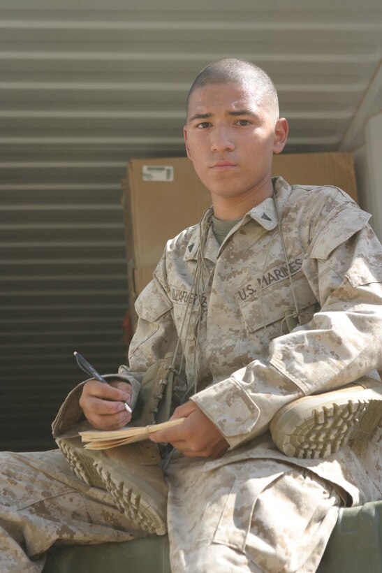 CAMP BLUE DIAMOND, RAMADI, Iraq - Lance Corporal Jorge T. Villafuerte,  a warehouseman with Headquarters Battalion, 2nd Marine Division ensures that the hundreds of Marines deployed here are equipped with the things they need to take the fight to the enemy. The influx of equipment, hygiene products, uniforms, boots and other items for the camp's inhabitants keeps him working for hours in the desert sun. Official Marine Corps photo by: Sgt. Ryan S. Scranton