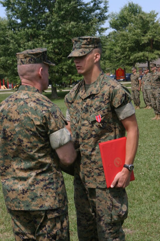 MARINE CORPS BASE CAMP LEJEUNE, N.C. (June 22, 2005) – Lance Cpl. Blake M. Benson of Lenox, Mich. was awarded the Bronze Star Medal with Combat Distinguishing Device here, June 21, for his actions taken while deployed in support of Operation Iraqi Freedom with 2nd Combat Engineer Battalion, 2nd Marine Division.