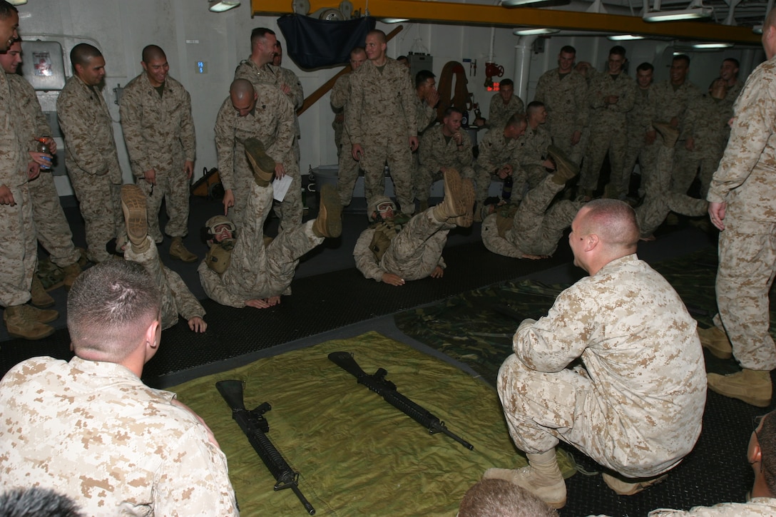 The Marines of Charlie Company, Battalion Landing Team 1/1, 15th Marine Expeditionary Unit (Special Operations Capable), take part in the endurance portion of the company's disassemble reassemble competition of small arms weapons here. The competition is used as a training tool to keep the Marines skills sharp while en route to the Arabian Pacific region.
