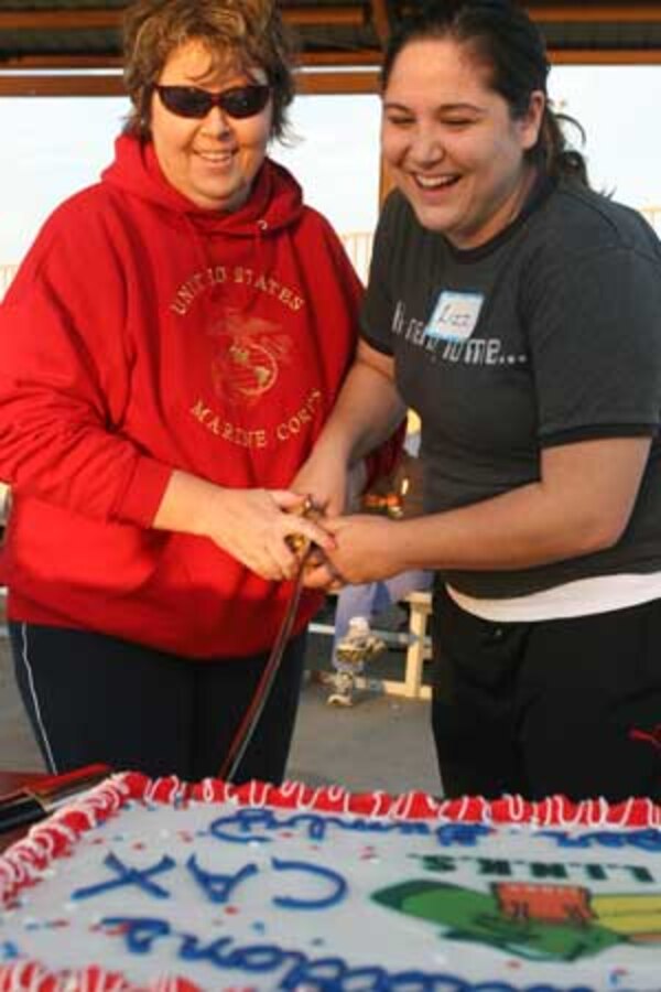 Brian Stelly, six-year poker player, puts on his poker face as he checks his hole cards during the Drug Demand Reduction Program?s No Limit Texas Hold ?Em poker tournament Saturday at the Sonoran Pueblo consolidated club here. Stelly made it to the final two tables, but was eliminated after going all in for a third time.