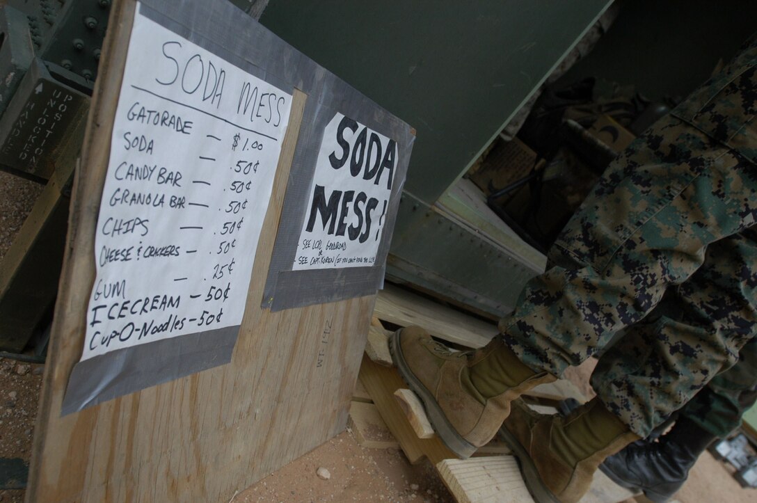 Robert Dochnahl, tournament participant, deals two cards to each player at his table during the Drug Demand Reduction Program?s No Limit Texas Hold ?Em poker tournament Saturday at the Sonoran Pueblo consolidated club here. In Texas Hold ?Em, players combine their two hole cards with three of five community cards to make the best hand possible.