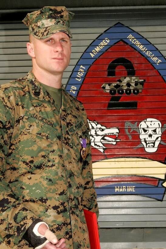 MARINE CORPS BASE CAMP LEJEUNE, N.C. - Sergeant Chadd E. Jackson, a light armored vehicle commander with 1st Platoon, Company A, 2nd Light Armored Reconnaissance Battalion, 2nd Marine Division, was awarded the Purple Heart here May 23.  While on deployment to Iraq, Jackson's light armored vehicle was hit by an improvised explosive device.