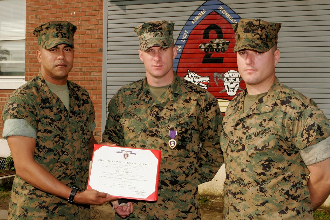 MARINE CORPS BASE CAMP LEJEUNE, N.C. - Sergeant Chadd E. Jackson, a light armored vehicle commander with 1st Platoon, Company A, 2nd Light Armored Reconnaissance Battalion, 2nd Marine Division, was awarded the Purple Heart here May 23.  While on deployment to Iraq, Jackson's light armored vehicle was hit by an improvised explosive device.