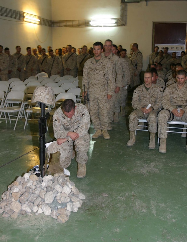 HADITHA DAM, Iraq (Nov. 23, 2005) - Marines of 3rd Battalion, 1st Marine Regiment, pay their respects to Tiahoga Falls, Ohio native Sgt. Jeremy E. Murray during a memorial service here Nov. 23. Murray is survived by his wife, Megan; son, Ian; mother, Pamela, and father Harold. (Official Marine Corps photo by Cpl. Adam C. Schnell)