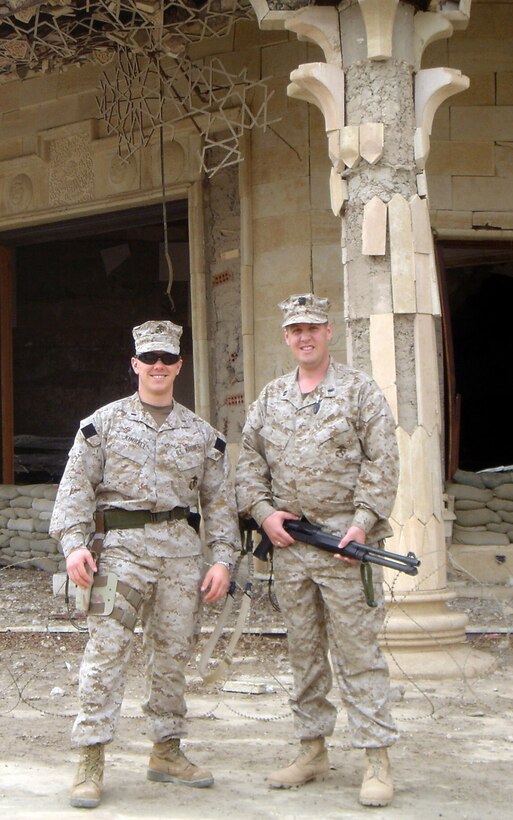 First Lieutenant John H. Kimball III (Left) and Navy Lieutenant James P. Burrill both hail from Lynnfield, Mass. stand in front of a bombed building here.  Both service members work in the same section and by coincidence they both attended Lynnfield High School and went to nearby colleges, Merrimack and Gordon College.  U.S. Marine Corps photo by Sgt. Stephen D'Alessio (RELEASED)