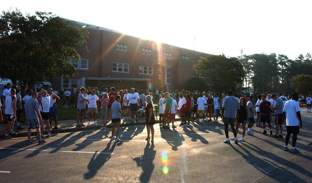 Participants in the CFC 5K Fun Run gathered outside Goetgge Memorial Field House before and after the race to  interact with some of the local organizations who had come to set up display booths and tables for collecting donations.