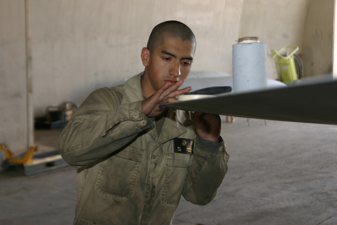 Lance Cpl. Miguel Agudo, airframer, VMFA(AW)-224 a New York native repairs a horizontal stab on one of the Bengal F/A-18 Hornets in between missions aboard Al Asad air base, Iraq, Feb. 24.