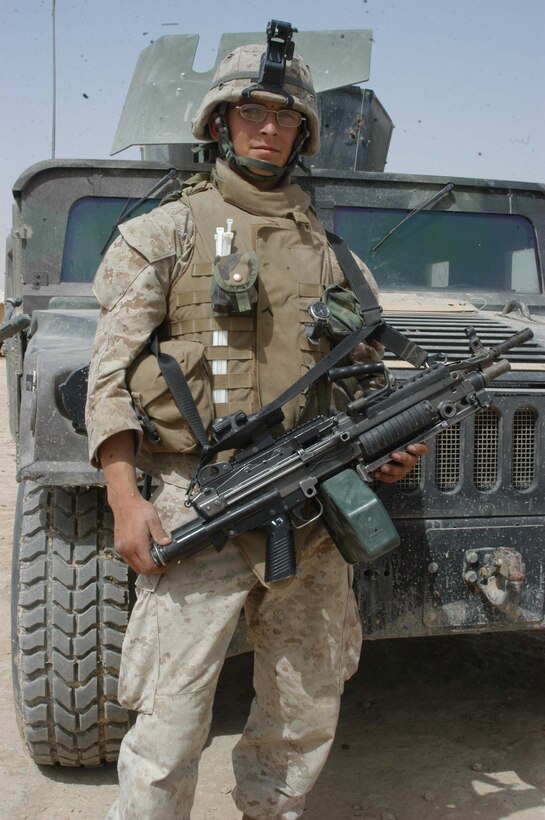 CAMP RAMADI, Ar Ramadi, Iraq (April 23, 2005) - Private First Class Bryan J. Nagel, a squad automatic weapon gunner with 2nd Squad, 2nd Platoon, Company B, 1st Battalion, 5th Marine Regiment, is responsible for saving the lives of his fellow Marines during an organized attack insurgents launched on a observation post in the city here April 20. The 20-year-old from Jamestown, N.D., engaged the driver of a suicide vehicle born improvised explosive device from his observation post with his weapon placing well-aimed rounds in the vehicles windshield. The 2003 Jamestown High School graduate destroyed the rolling bomb and prevented the martyr from reaching the Marines' position. Photo by Cpl. Tom Sloan