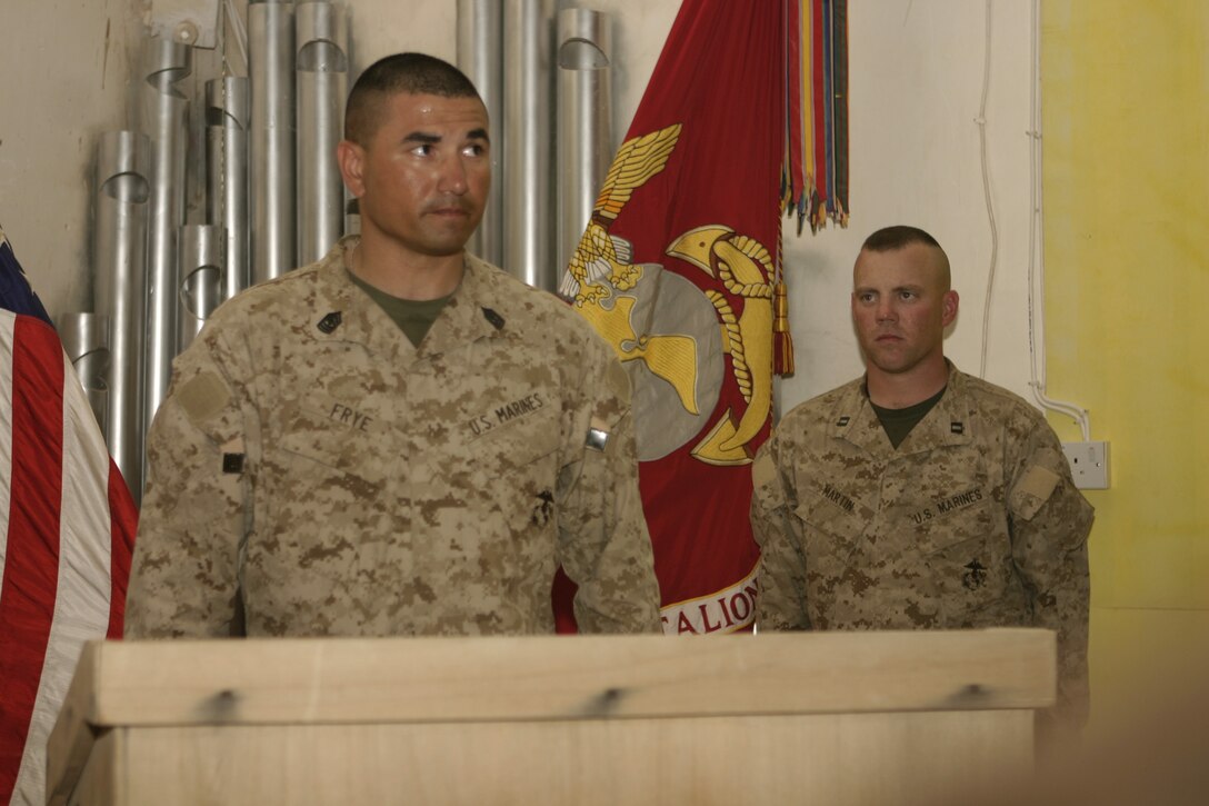CAMP BAHARIA, Iraq - 1st Sgt. William Frye, Weapons Company, 1st Battalion, 6th Marine Regiment's first sergeant, performs role call during Hospitalman Aaron A. Kent's memorial service here April 24.  The 28-year-old Portland, Ore. native passed away April 23 when his vehicle struck an improvised explosive device in a roadway outside Fallujah.