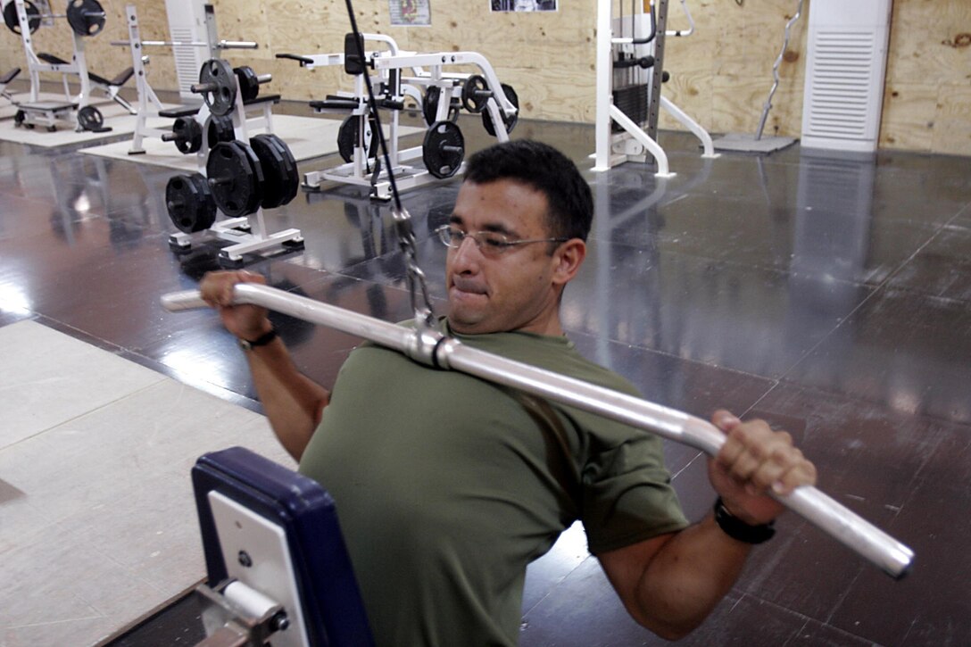 Camp Ripper, Iraq (October 24, 2005)-- Brooklyn, N.Y., native,  Sgt. Johnny A. Noguera, 30,a gym manager at the Staff Sgt. Kendall H. Ivy II Memorial gym exercises during a slow period at the gym. The gym that opened in August has been a place of relaxation for those that need to work off the stress of being a combat zone. Ivy who died during Operation Matador was a well-known Marine for those working with Regimental Combat Team-2 and is often described him as the poster child for a true Marine. (Official USMC Photo by Corporal Ken Melton)