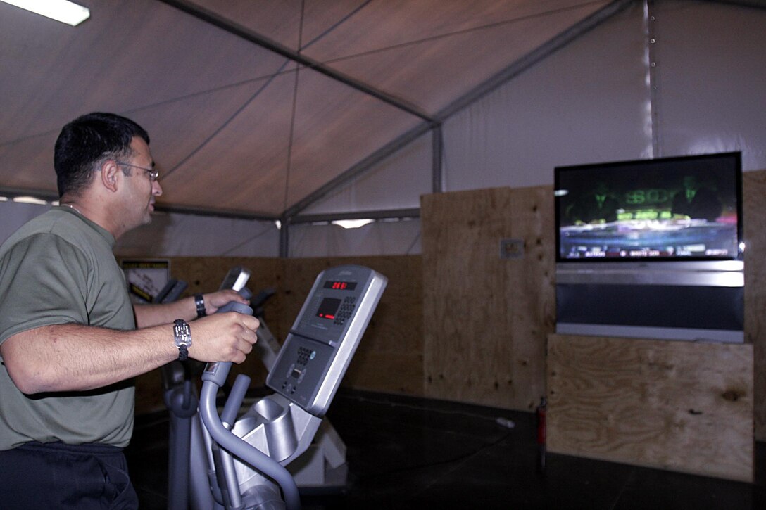 CCamp Ripper, Iraq (October 24, 2005)-- Brooklyn, N.Y., native,  Sgt. Johnny A. Noguera, 30,a gym manager at the Staff Sgt. Kendall H. Ivy II Memorial gym exercises during a slow period at the gym. The gym that opened in August has been a place of relaxation for those that need to work off the stress of being a combat zone. Ivy who died during Operation Matador was a well-known Marine for those working with Regimental Combat Team-2 and is often described him as the poster child for a true Marine. (Official USMC Photo by Corporal Ken Melton)