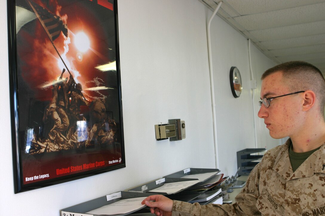 MARINE CORPS BASE CAMP LEJEUNE, N.C. (January 24, 2005) - Private First Class James D. Sirois is doing his part to maintain the enlistment retention effort as an administrative clerk with Headquarters Battalion, 2d Marine Division's Career Retention Specialist Office. Sirois's job is to maintain a record of who reenlist or extends their contract in the Marine Corps giving an accurate number of Marine personnel still with the division.  Official Marine Corps photo by Pfc. Terrell A. Turner released.