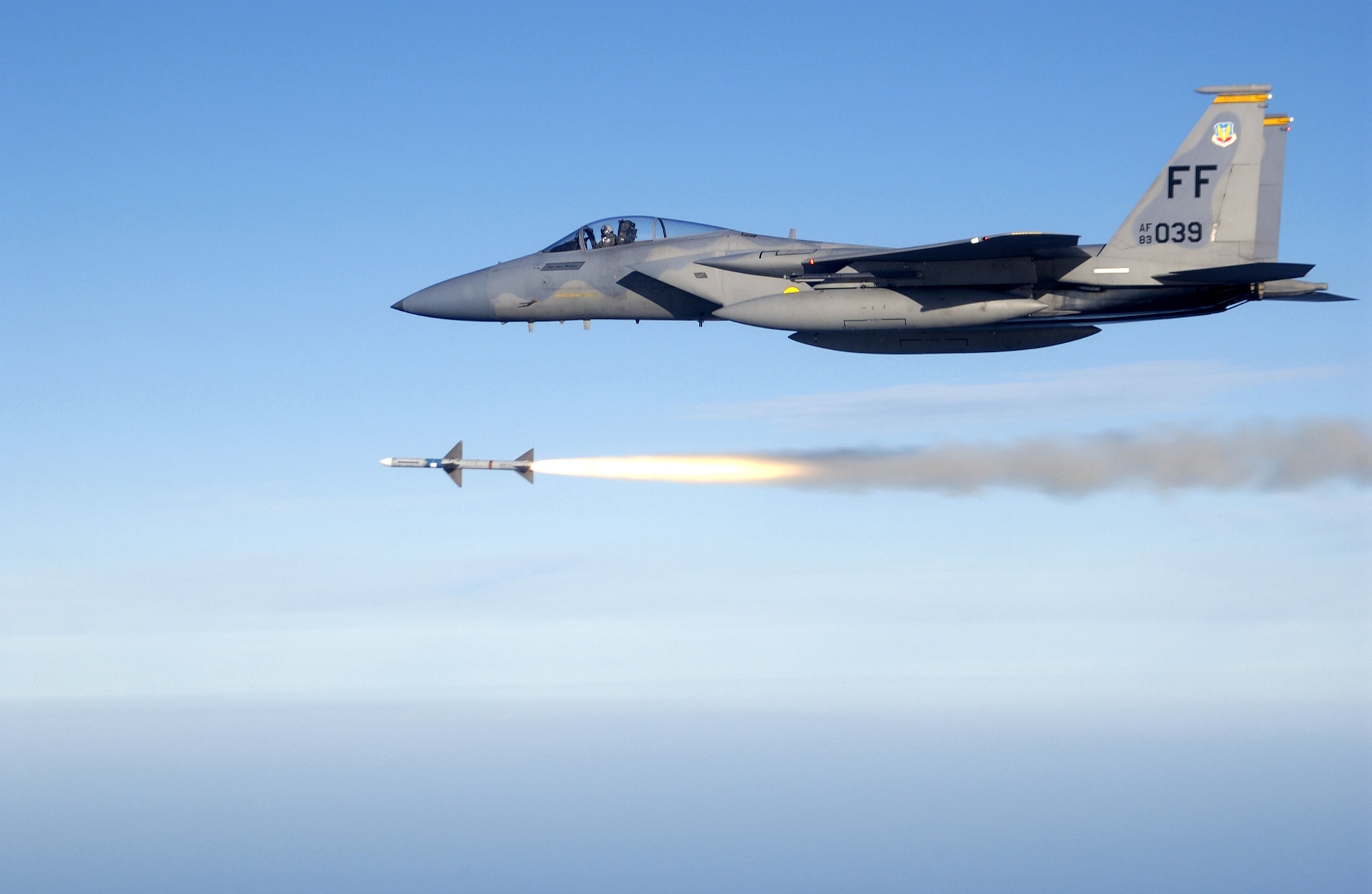 OVER THE GULF OF MEXICO -- First Lt. Charles Schuck fires an AIM-7 Sparrow medium range air-to-air missile from an F-15 Eagle here while supporting a Combat Archer air-to-air weapons system evaluation program mission.  He and other Airmen of the 71st Fighter Squadron deployed from Langley Air Force Base, Va., to Tyndall AFB, Fla., to support the program.  (U.S. Air Force photo by Master Sgt. Michael Ammons) 
