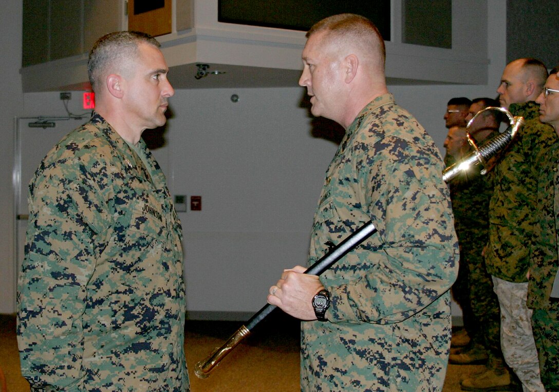 Sgt. Maj. Donnie R. Barrett, outgoing 24th Marine Expeditionary Unit sergeant major, receives a Bronze Star Medal from 24th MEU Commanding Officer, Col. Ron. Johnson, during the 24th MEU?s Sergeant Major Post and Relief Ceremony at Camp Lejeune, N.C., following the MEU?s successful return from Iraq.