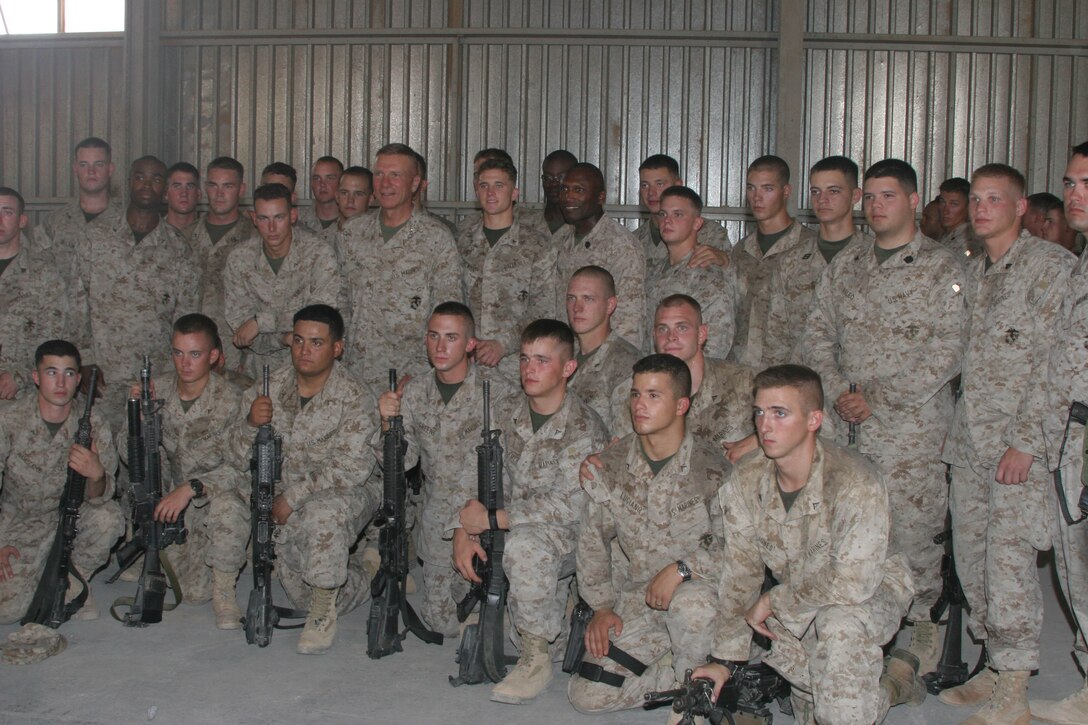 CAMP AL QA'IM, Iraq (July 25, 2005)- Commandant of the Marine Corps General Michael W. Hagee and Sergeant Major of the Marine Corps pose for a picture with 3rd Platoon, Company K, 3rd Battalion, 2nd Marine Regiment during their visit here July 25. (Official U.S. Marine Corps photo by Lance Cpl. Lucian Friel (RELEASED)