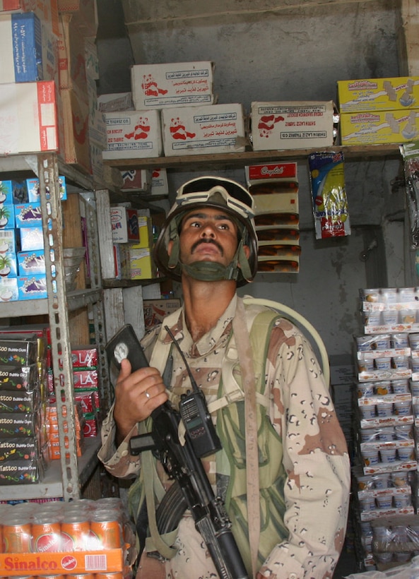 050907-M-2607O-006 KARMA, Iraq -- An Iraqi Army soldier searches one of the many shops for Improvised Explosive Device materials and anti-coalition forces propaganda in the Karma Market during Operation Free Market, Sept. 7.  Approximately one-third of the battalion and numerous Iraqi soldiers were involved in this operation to try and retrieve information and IED materials from the market.