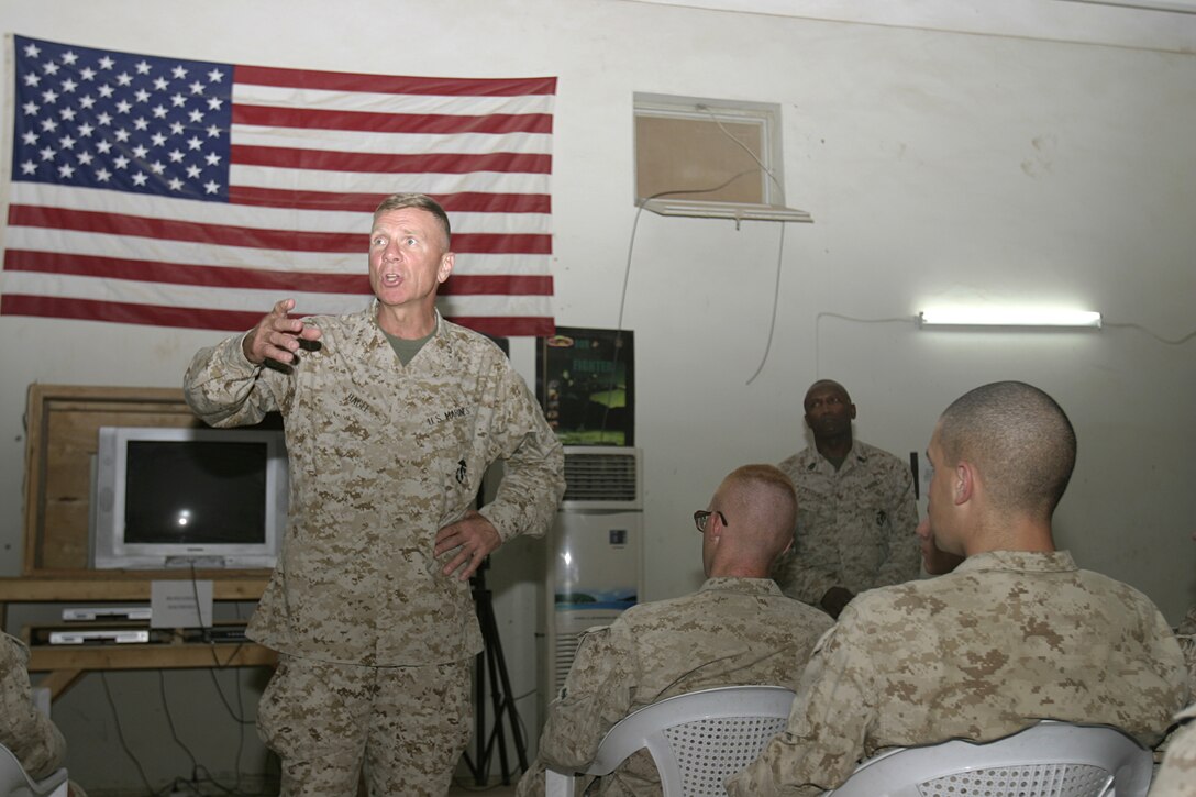 FALLUJAH, Iraq - Commandant of the Marine Corps Gen. Michael W. Hagee addresses several Marines and sailors of 1st Battalion, 6th Marine Regiment aboard one of their forward operating bases here Sept. 25.  Hagee and Sgt. Maj. of the Marine Corps John L. Estrada congratulated the homebound warriors for their successes training and operating alongside the Iraqi Security Forces in the area throughout the past seven months.