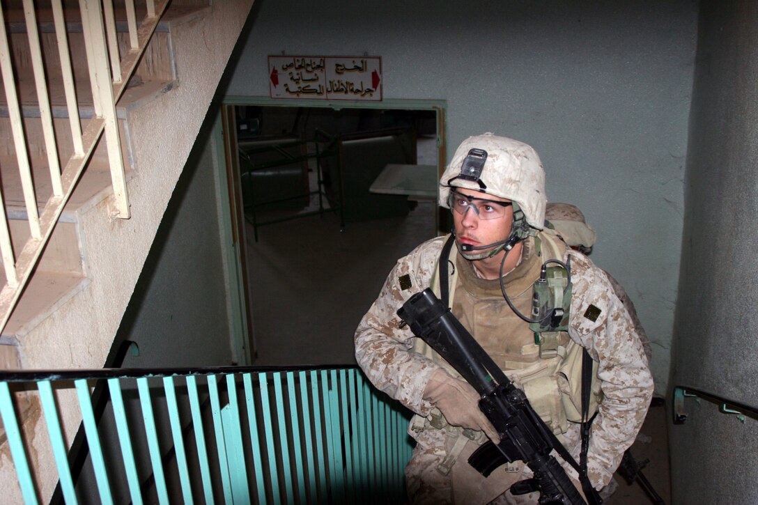 AR RAMADI, Iraq (October 28, 2005) - Corporal Brown, squad leader from 3rd platoon, Company L, 3rd Battalion, 7th Marine Regiment patrols up a stairwell inside the Women's and Children's Hospital during Operation Doctor Oct. 25. The humanitarian mission was led by local ISF soldiers and included more than $500,000 worth of medical supplies for the people of Ar Ramadi. Photo by Cpl. Shane Suzuki