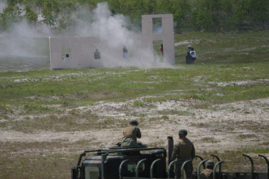 MARINE CORPS BASE CAMP LEJEUNE, N.C. (May 25, 2005) – Infantry Marines with 2nd Battalion, 6th Marine Regiment, 2nd Marine Division demonstrated new training capabilities here May 14, which when implemented, can help Marines combat this threat in the future.  The Marines performed convoy drills at Observation Post 2 as part of the new Convoy Operations Course displaying the beginnings of a new, more realistic training facility.  ::n::The course simulates near and far ambushes where a vehicle goes down and Marines have to dismount and attack.  There are also simulated hostages and the Marines have to react to insurgents using civilians as shields.  Photo by Pfc Terrell A Turner