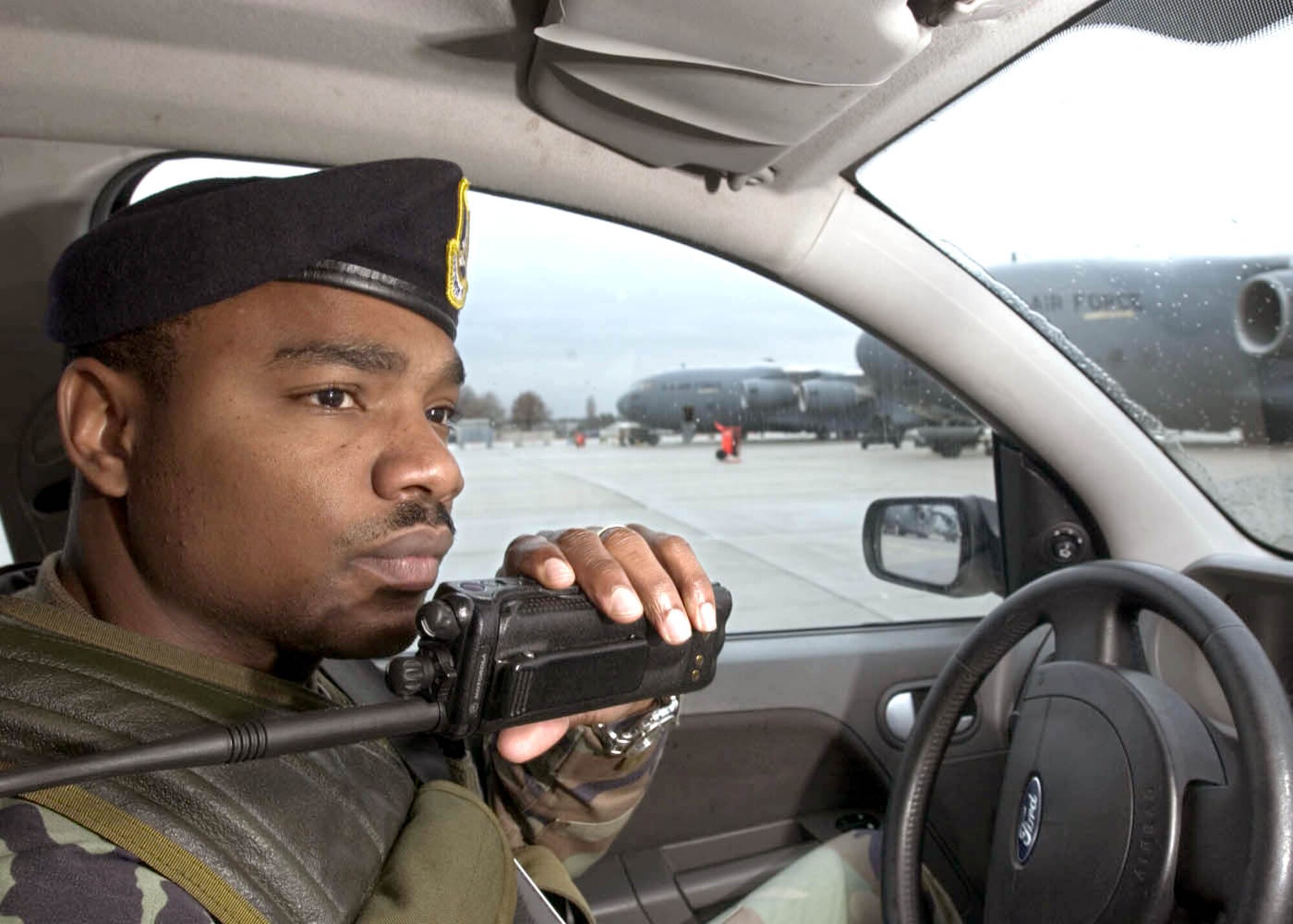 RHEIN-MAIN AIR BASE, Germany -- Staff Sgt. Larry Cleveland calls in his status on the flightline here.  Sergeant Cleveland is augmenting the 469th Air Base Group's security forces flight from the 435th Security Force Squadron at nearby Ramstein Air Base.  (U.S. Air Force photo by Master Sgt. John E. Lasky)