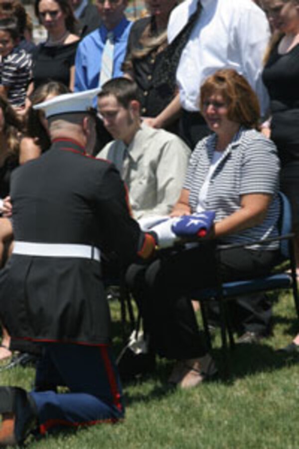 Sgt. Bryan Sonnier, air conditioning mechanic, Marine Air Control Squadron-1, holds his wife Jennifer after arriving at the station Feb. 27 from a seven month deployment to Iraq.