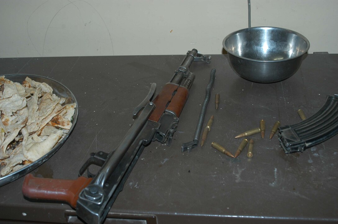 AR RAMADI, Iraq (March 25, 2005) - Each household is authorized one AK-47 and ammunition for it. This weapon was found in the closet of a house leathernecks with 1st Platoon, Company B, 1st Battalion, 5th Marines, searched March 25. The Marines searched several houses in the western part of the city here for a man they suspect is a member of the jihad group Jaysh Mohamed, which is connected with producing improvised explosive devises and has been linked to several IED attacks.They also searched for illegal weapons, weapons caches and checked identification cards of the men in each house they searched. Photo by Cpl. Tom Sloan