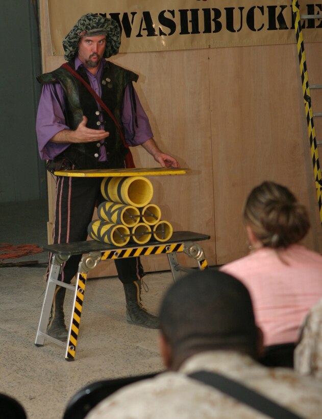 CAMP BLUE DIAMOND, AR RAMADI, Iraq -Juggler, comedian and trickster, Todd Key of Grantville, Ga., prepares the crowd for his next performance during Operation Swashbuckle. The 42-year-old Keys is part of a four-man comedy show presented by Hack and Slash, who provided an explosive round of entertainment for more than 100 Marines, sailors and soldiers here serving with the 2nd Marine Division in support of Operation Iraqi Freedom.