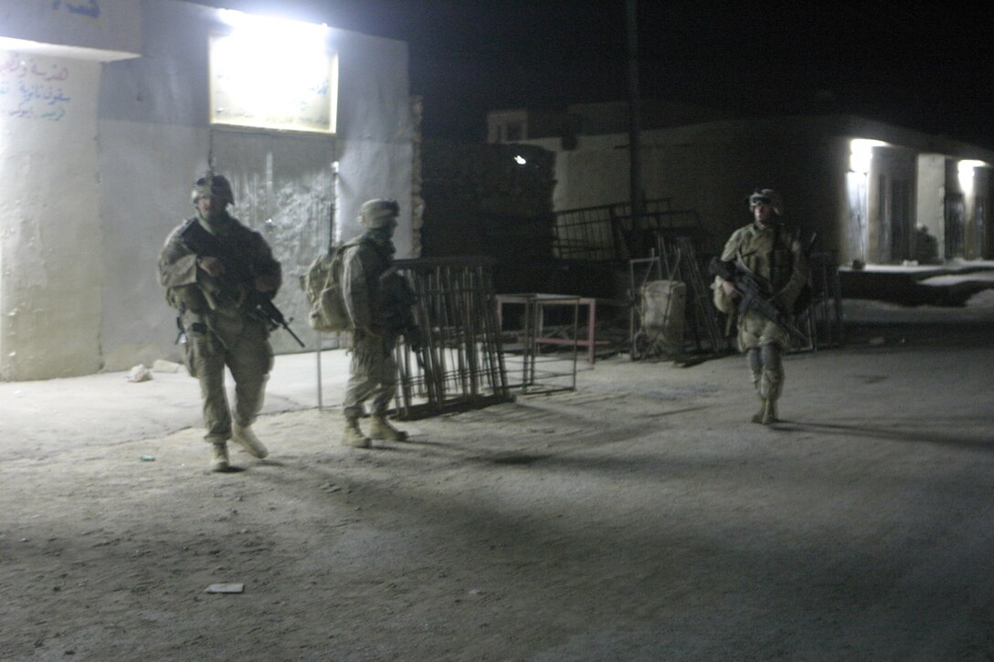 Haditha, Al Anbar, Iraq (May 26, 2005) -  Platoon Commander Sean M. O'neill, 28 of Sewickly, Penn., and other Marines with 3/25, 1st platoon proceed with caution down the streets of Haditha during a recent mission.  (Official USMC photo by Cpl. Ken Melton)